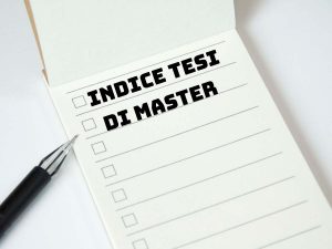 Blocco note con la scritta Indice tesi di master e una penna accanto